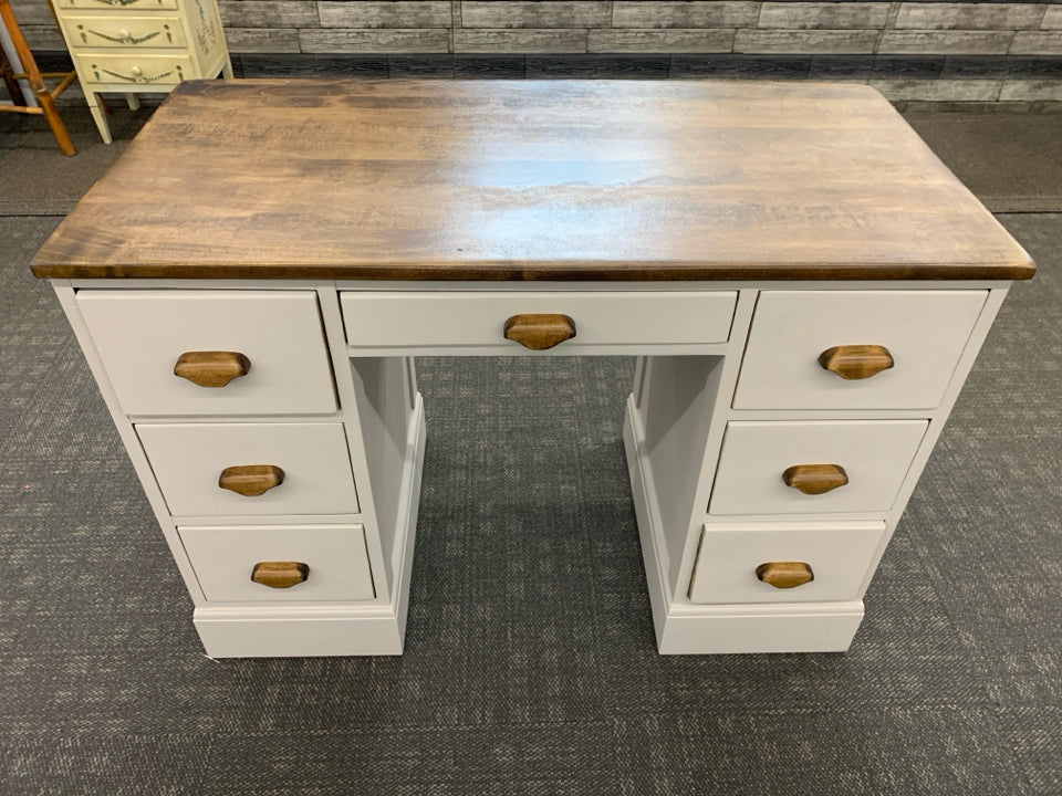 WOOD-TOP GRAY PAINTED 7-DRAWER DESK.