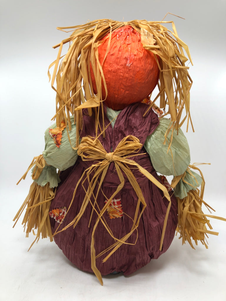 STRAW SCARECROW W/PURPLE OVERALLS.
