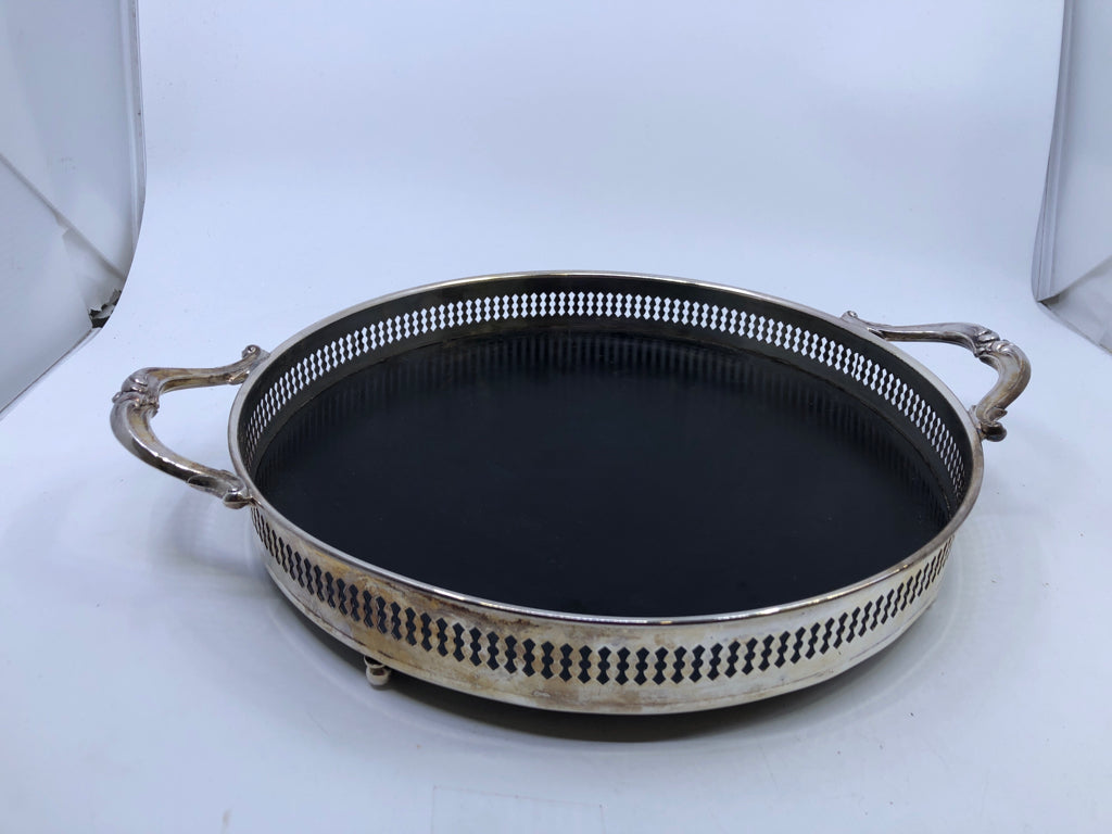VTG SILVERPLATED FOOTED CIRCLE TRAY W/ BLACK BOTTOM FORMICA HANDLES.