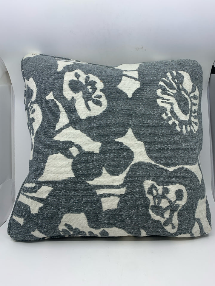 WHITE W/ BLUE/GRAY FLORAL PATTERN PILLOW.