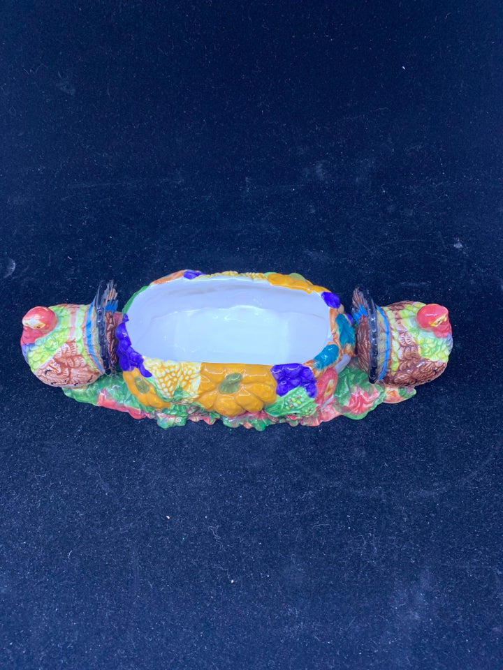 COLORFUL THANKSGIVING DISH W TURKEYS ON END.