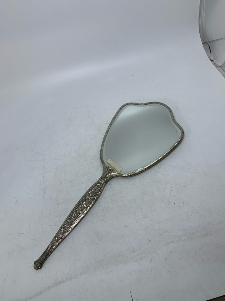 VTG SILVER PLATED HAND HELD MIRROR W/ EMBOSSED ROSE ON BACK.