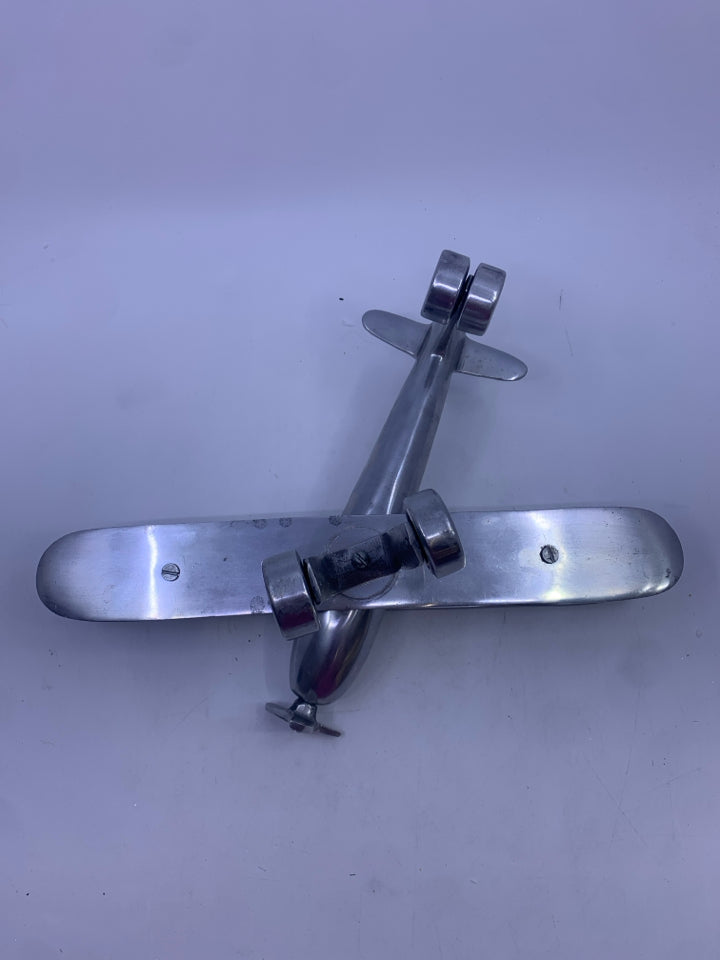 MATTE SILVER METAL AIRPLANE W/ MOVABLE WINGS.