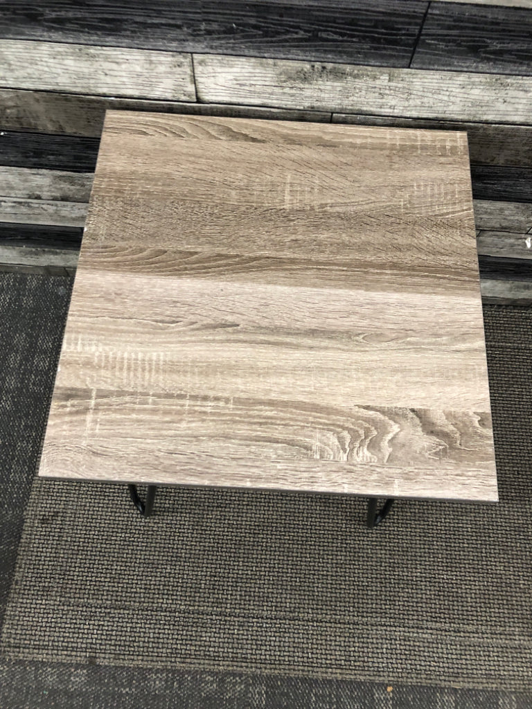 FAUX GREY WOOD SIDE TABLE W/ BLACK METAL PIN HAIR LEGS.
