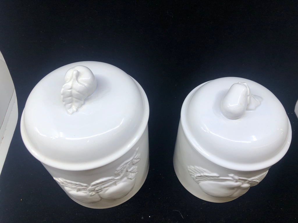 2 WHITE EMBOSSED APPLE CANISTERS.