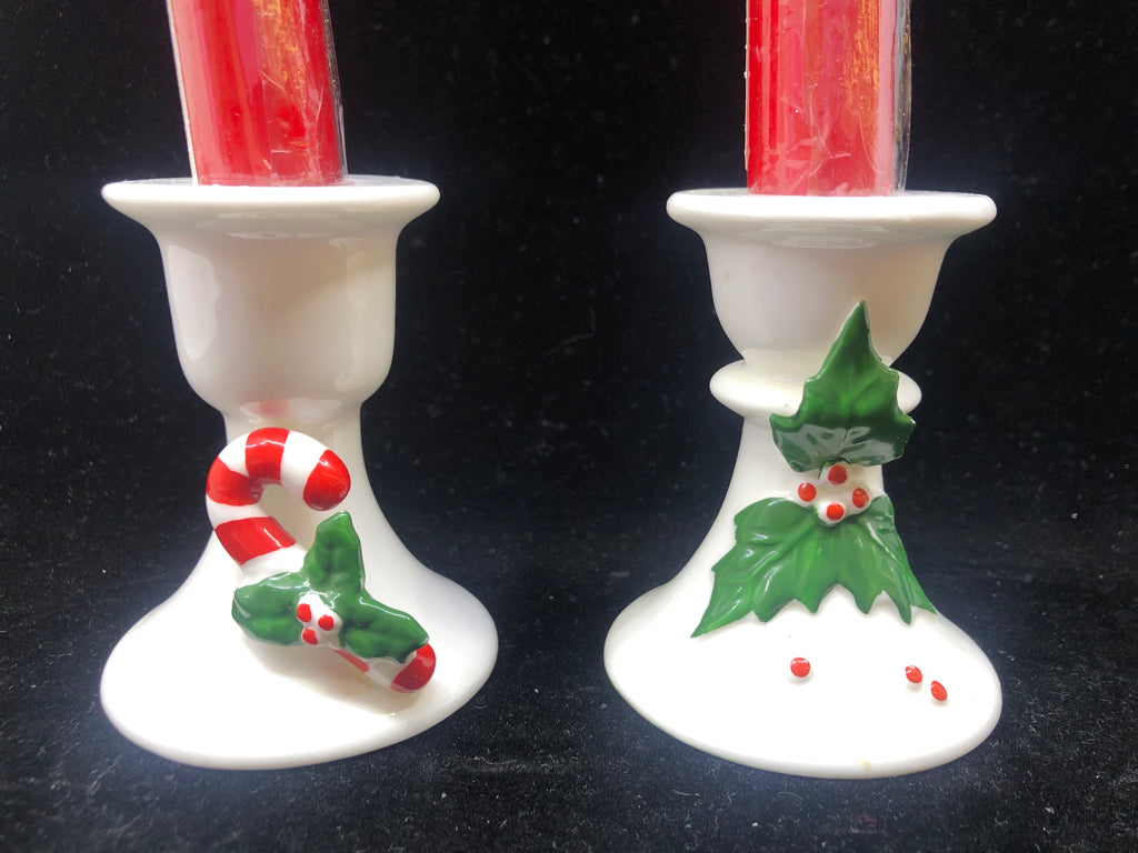 2 WHITE TAPER CANDLE HOLDERS-HOLLY & CANDY CANE WITH RED TAPER CANDLES.