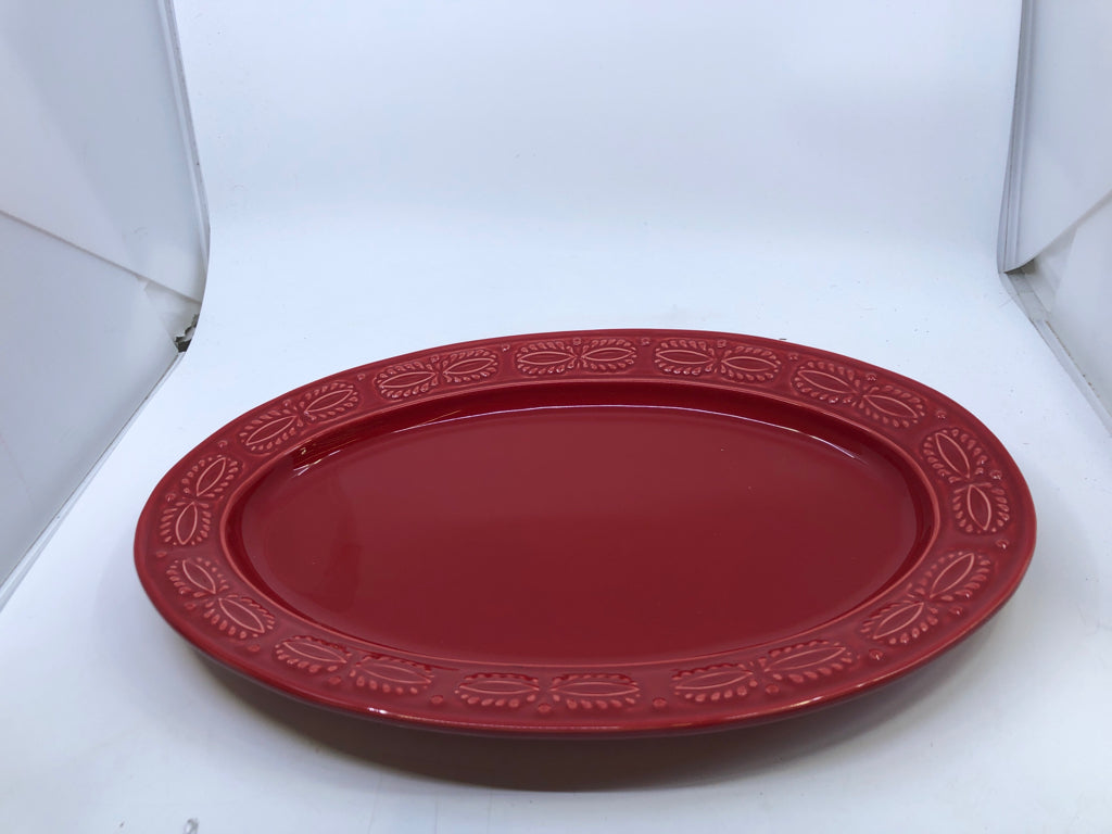 RED OVAL SERVING PLATTER W/ EMBOSSED EDGE.