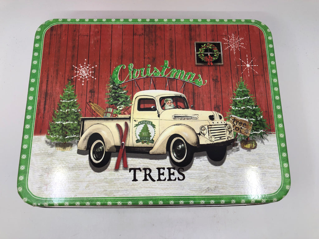 2 NESTING TINS W/ CREAM VINTAGE TRUCK W/ SANTA DRIVING.