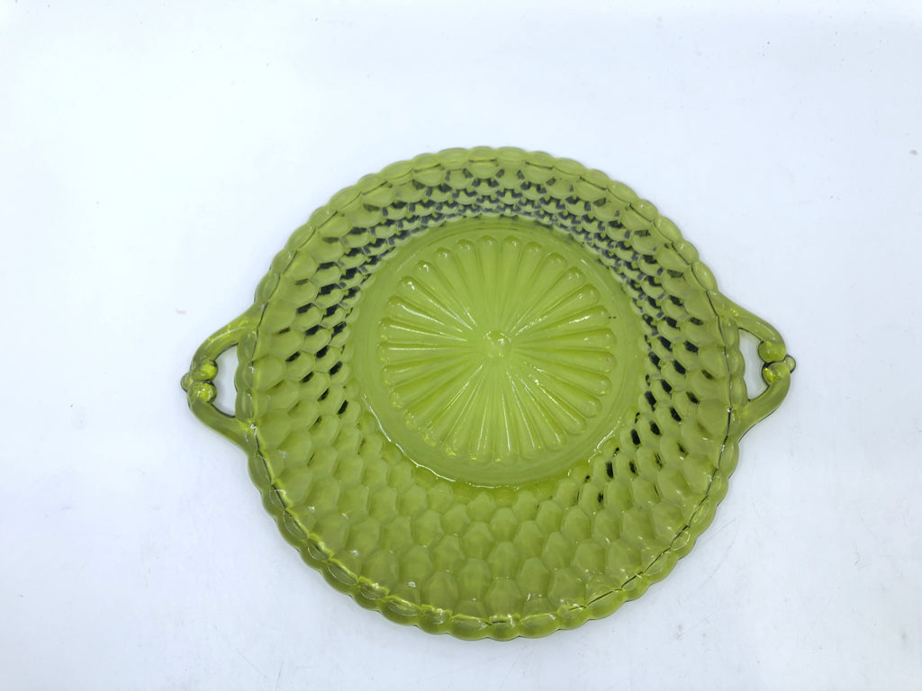 GREEN CUT GLASS BOWL W HANDLES.