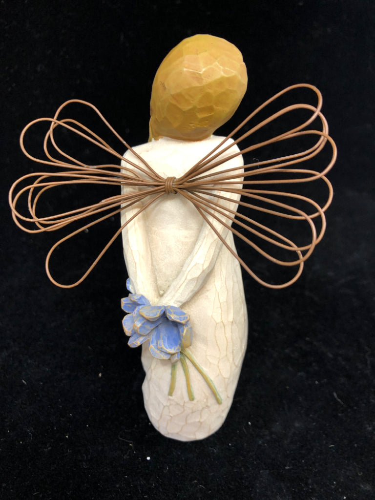 GIRL HOLDING BLUE FLOWERS BEHIND BACK THANK YOU.