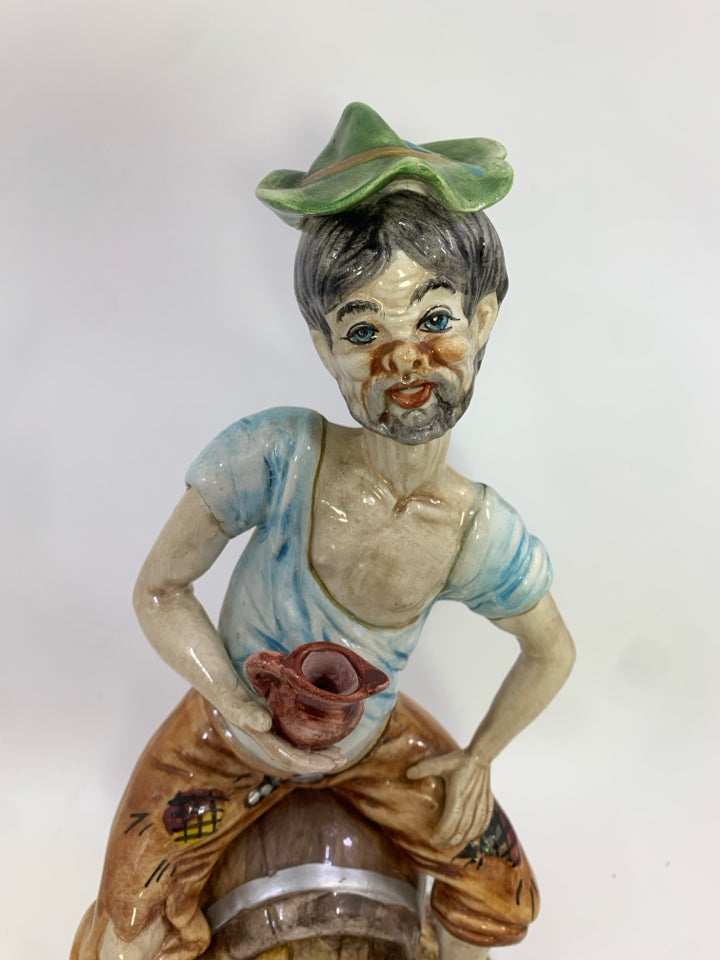 VTG CAPODIMONTE PORCELAIN MAN SITTING ON BARREL FIGURINE.
