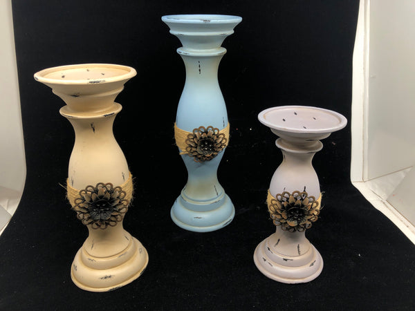 3 PAINTED CANDLE PILLAR HOLDERS W METAL FLORAL FRONT.