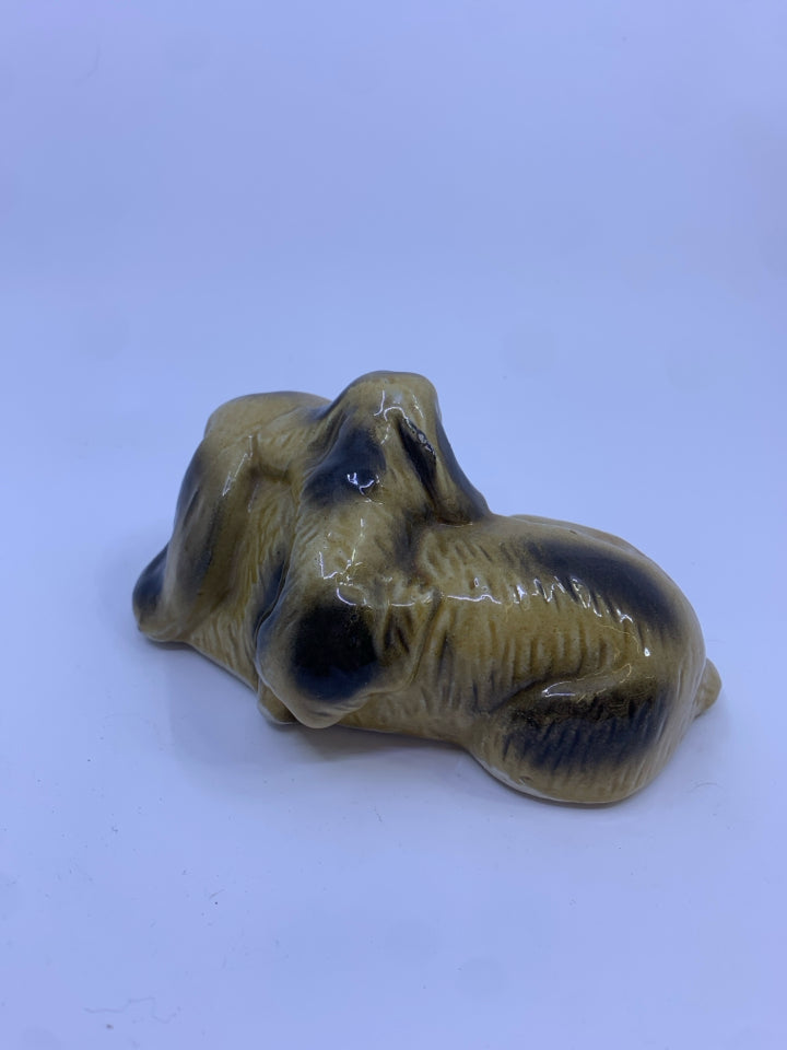 CERAMIC SLEEPING DOG FIGURE.