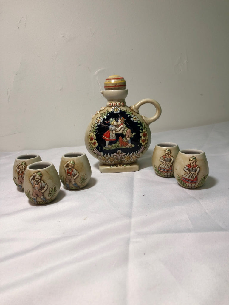6PC SMALL GERMAN EMBOSSED PEOPLE GLASSES AND DECANTER.
