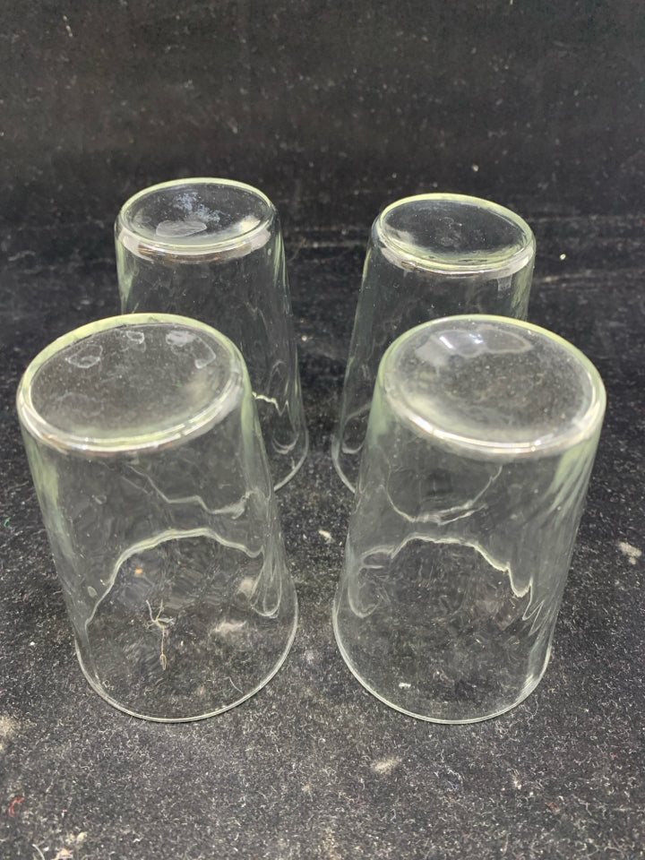 4 SLIGHTLY RIBBED JUICE GLASSES.