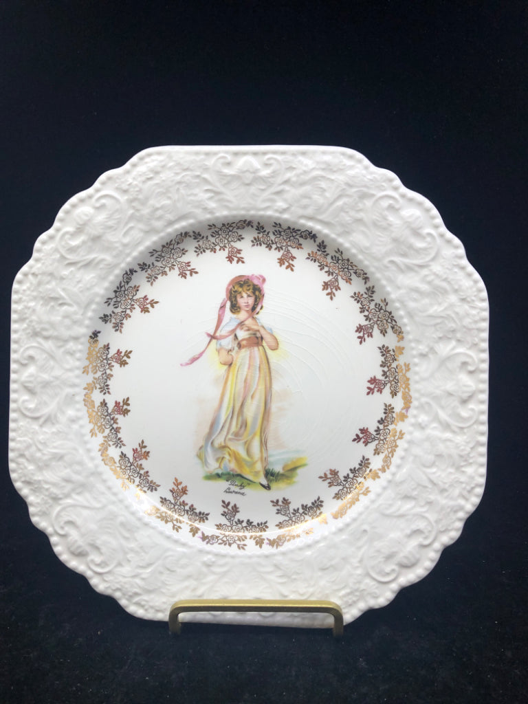 EMBOSSED PINK PLATE W GOLD ACCENTS.