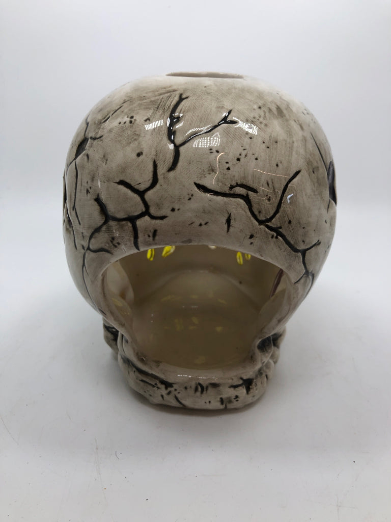 CERAMIC CRACKLE SKULL CANDLE HOLDER.