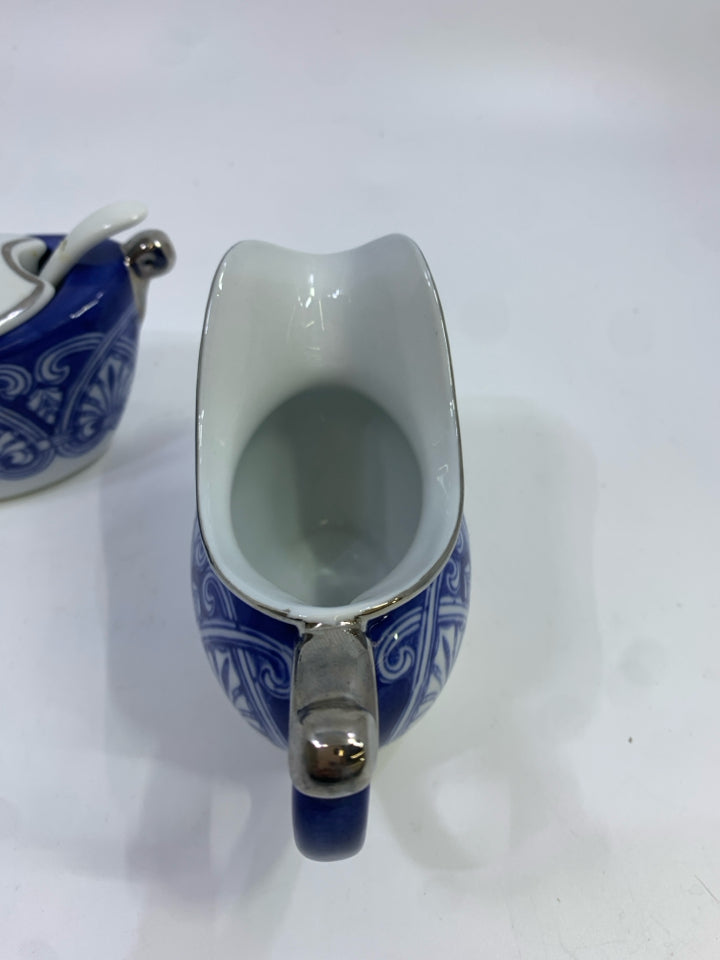 PORCELAIN SUGAR AND CREAMER BLUE W/SILVER TRIM.