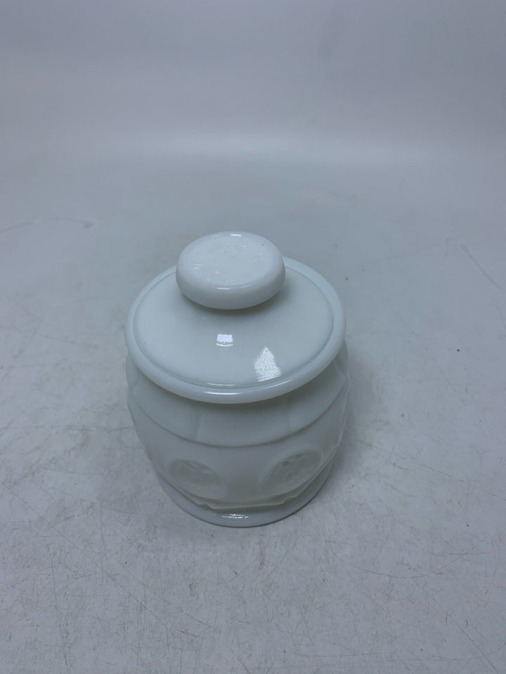 VTG SMALL MILK GLASS CANISTER W/ EAGLE COIN DETAILS.