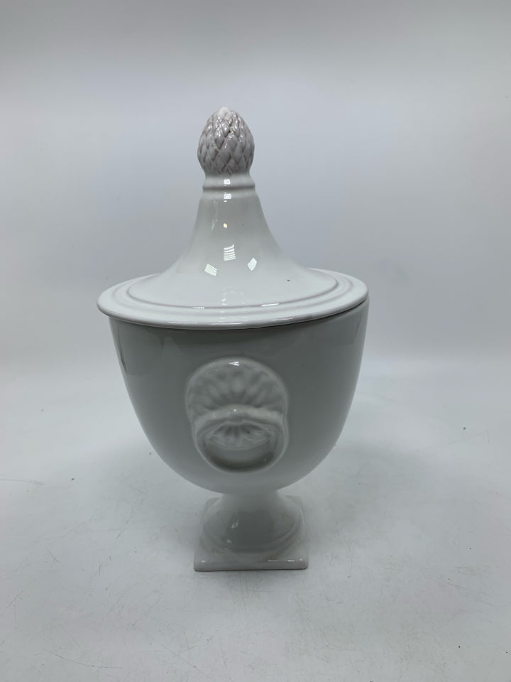 FOOTED URN SHAPED CANISTER W/ POINTED TOP.