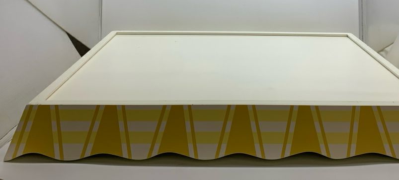 YELLOW WOOD TRAY W/BLUE PAINTED LEAVES AND WAVY EDGE.