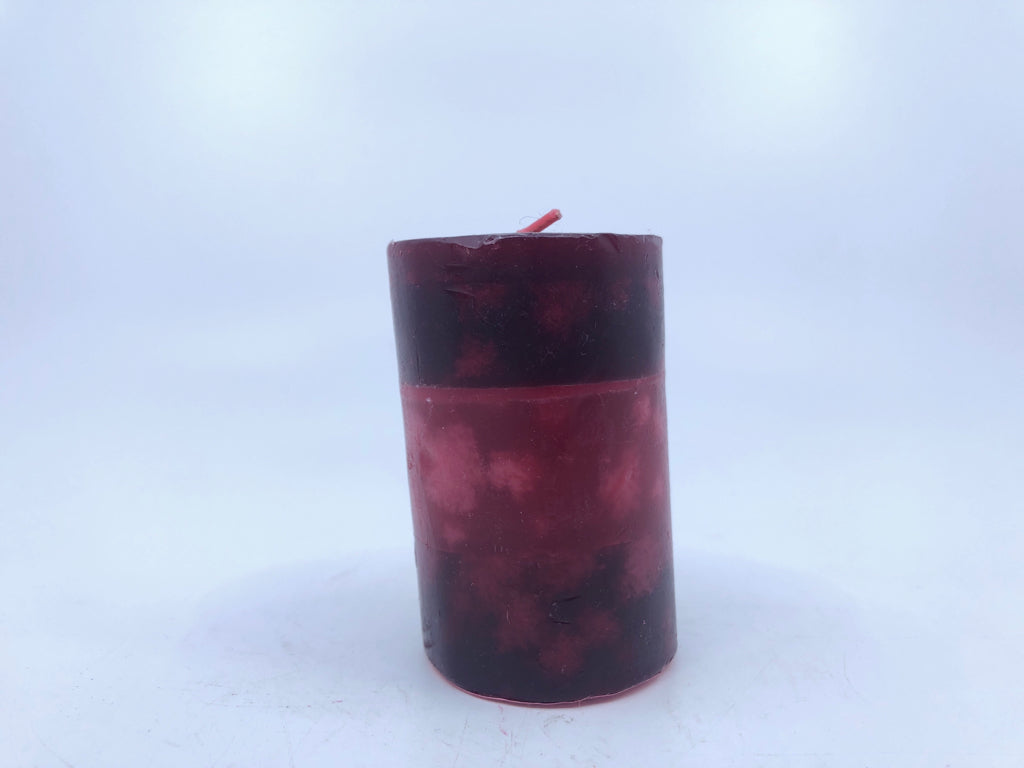 RED PILLAR CANDLE.