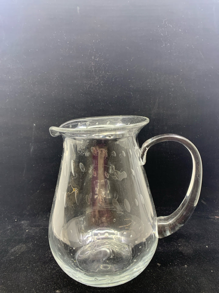 CLEAR GLASS PITCHER W/ CIRCLE DESIGNS.