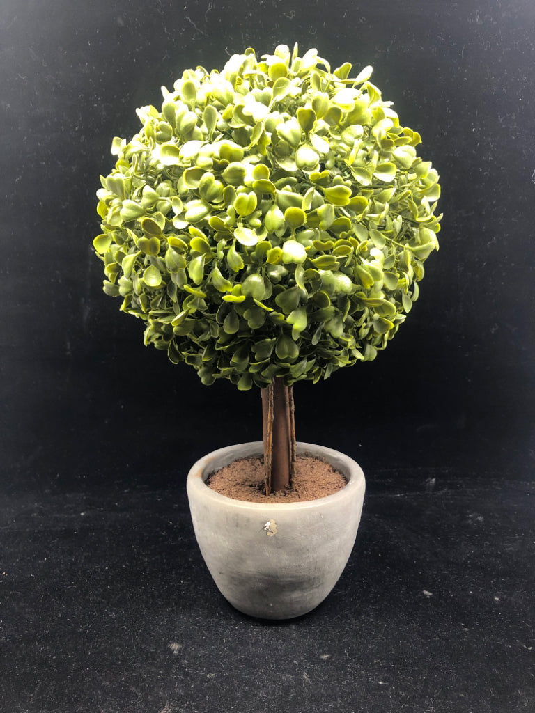 FAUX SHRUB CIRCLE TREE IN GRAY CEMENT PLANTER.