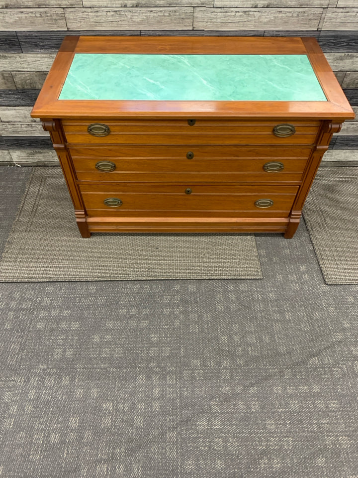 CHERRY WOOD CABINET W 3 DRAWERS AND GREEN MARBLE TOP.