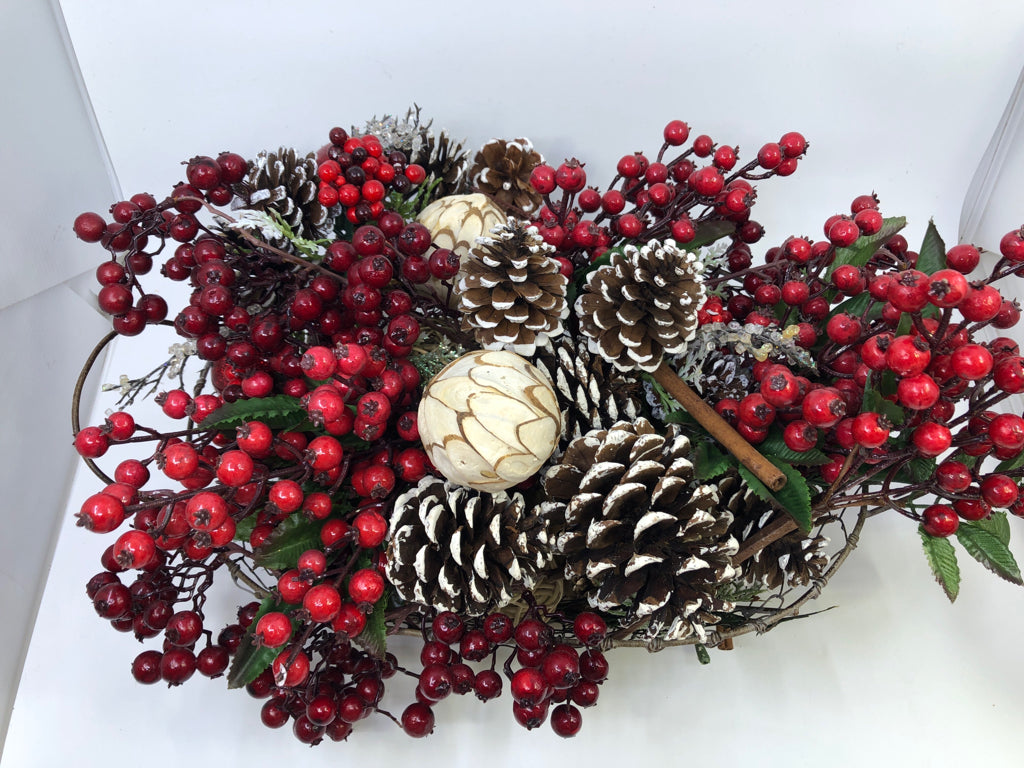 BASKET FULL OF FAUX HOLIDAY ARRANGEMENT.