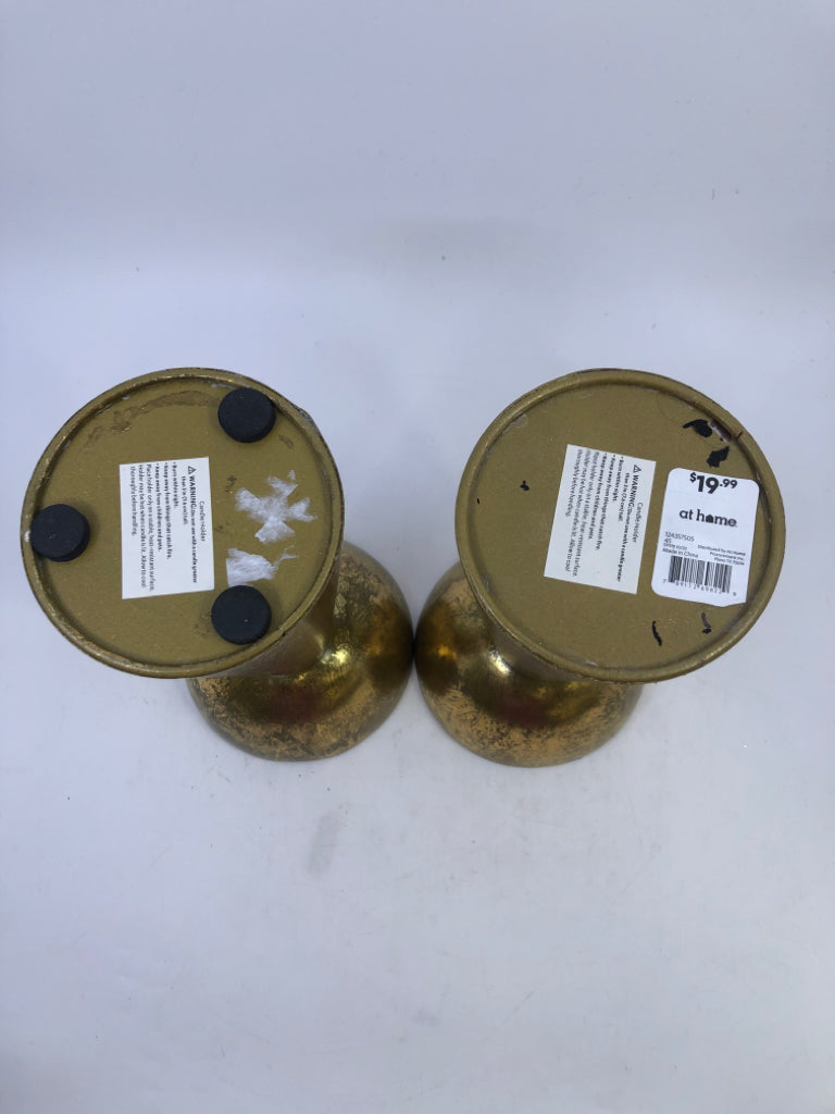 2 GOLD METAL PILLAR CANDLE HOLDERS.
