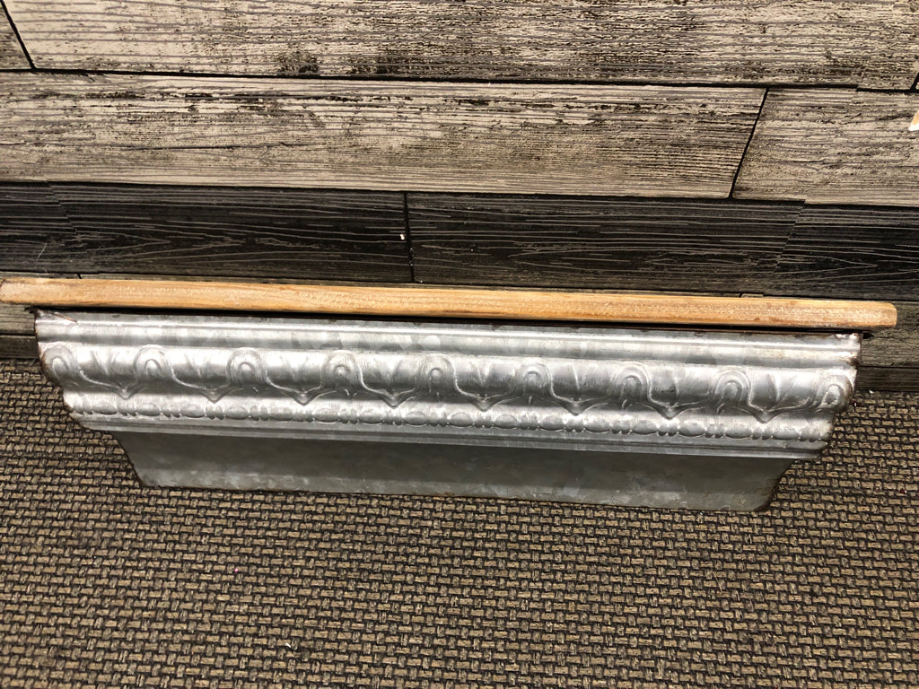 WOOD WALL SHELF WITH METAL BOTTOM ACCENT.