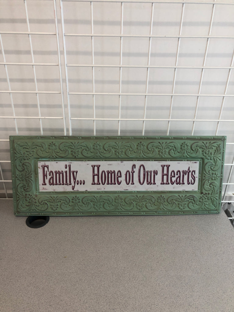 FAMILY HOME OF OUR HEARTS GREEN METAL WALL HANGING.