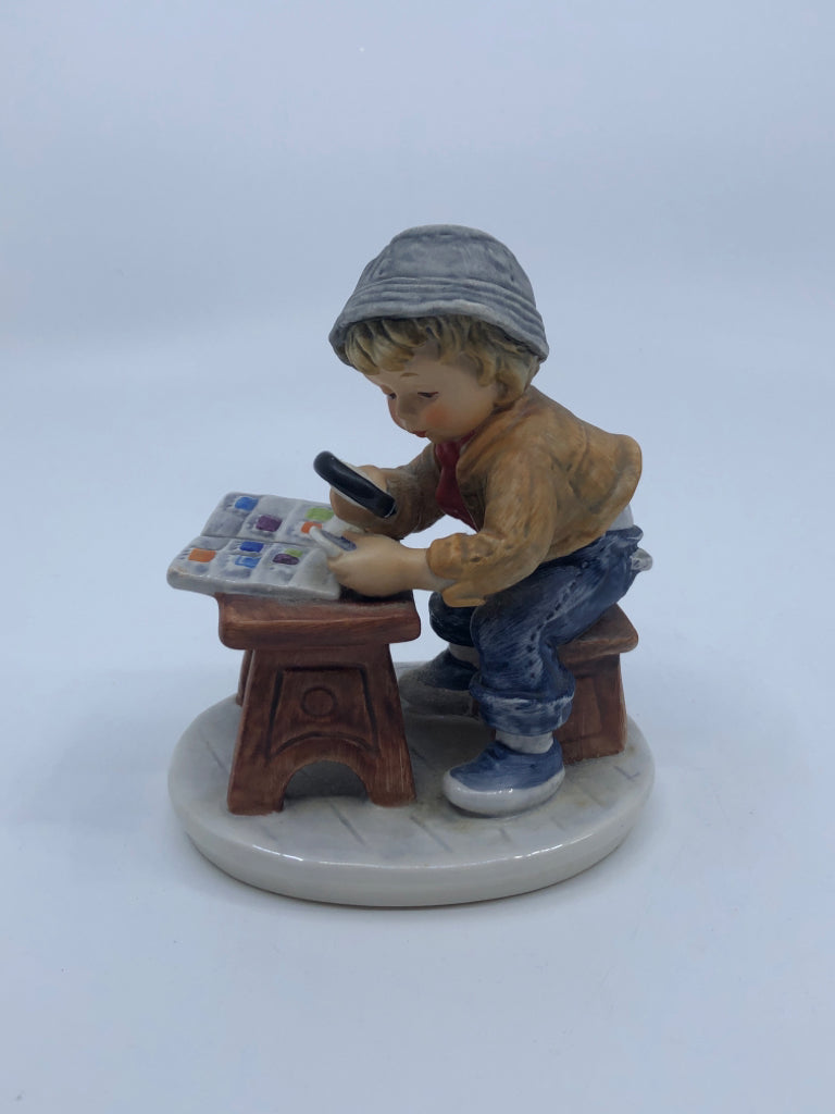 GOEBEL SITTING BOY W/MAGNIFY GLASS- STAMP COLLECTOR.