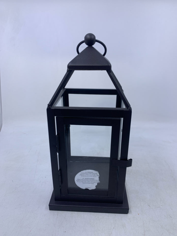 BROWN METAL TEA LIGHT HOLDER LANTERN.