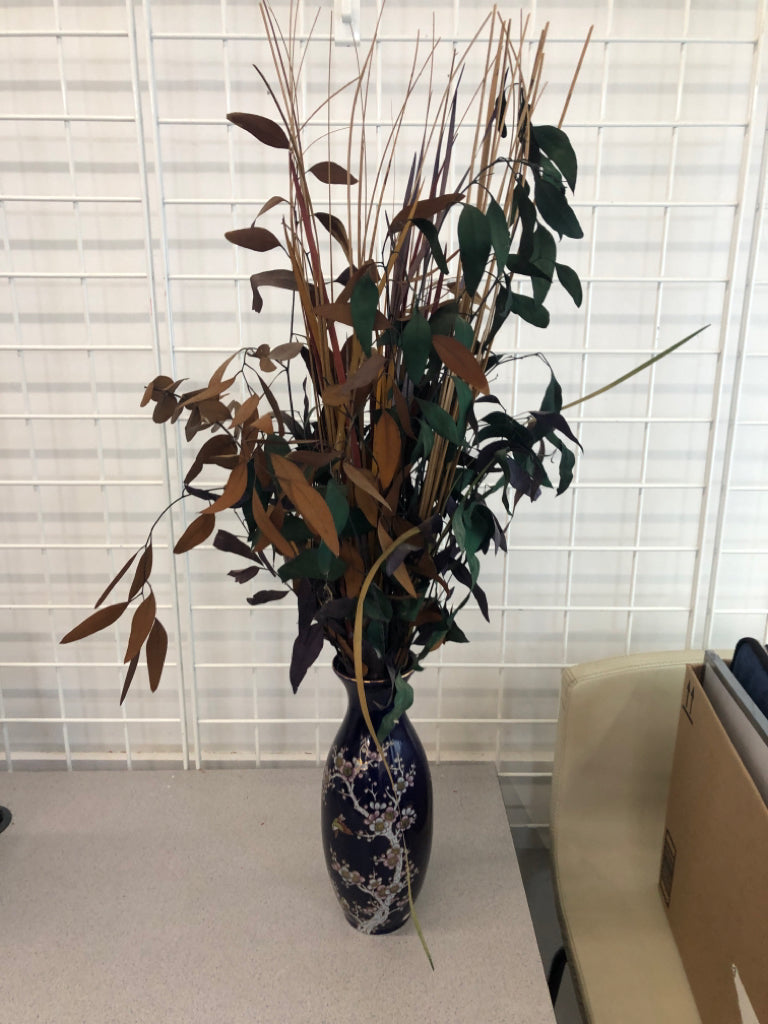 FAUX DARK FOLIAGE IN BLUE FLORAL VASE.