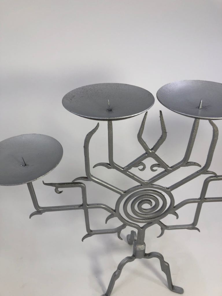 SILVER PAINTED METAL 4 SECTION CANDLE HOLDER.