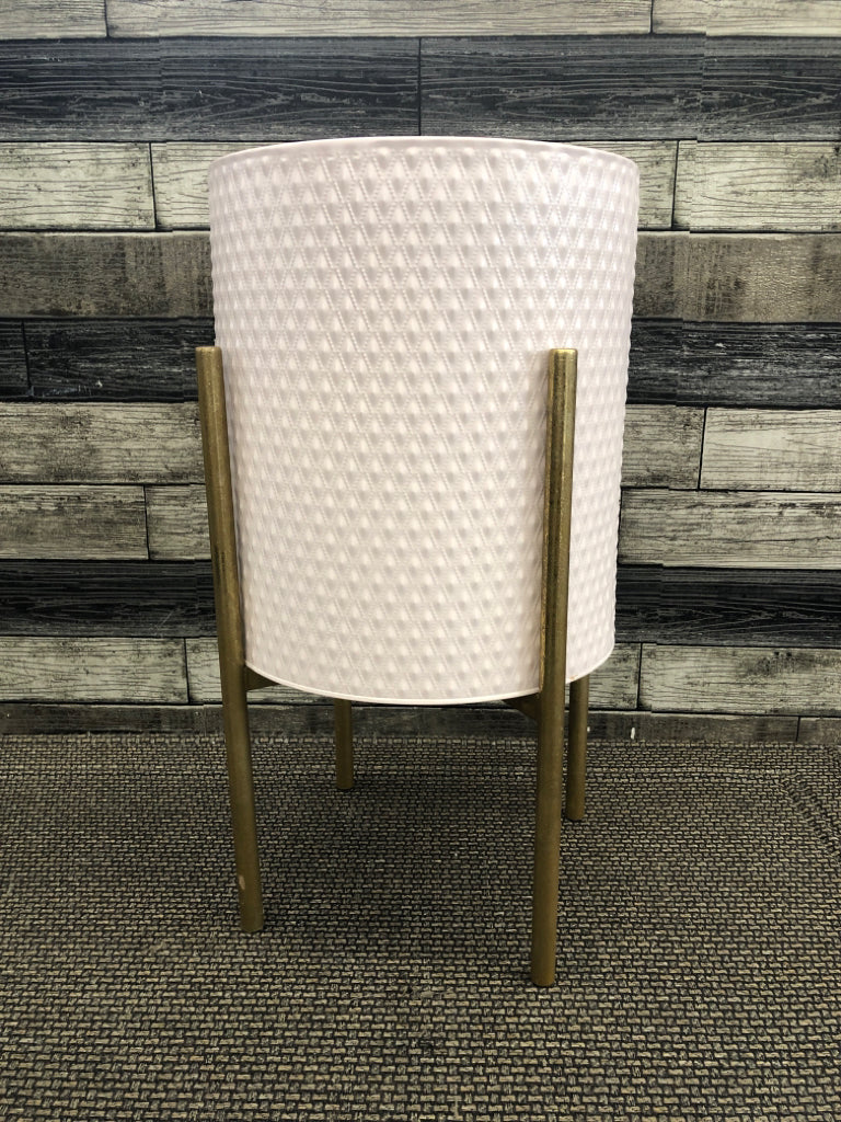 GOLD 3 LEGGED PLANT STAND W/PINK METAL PLANTER.