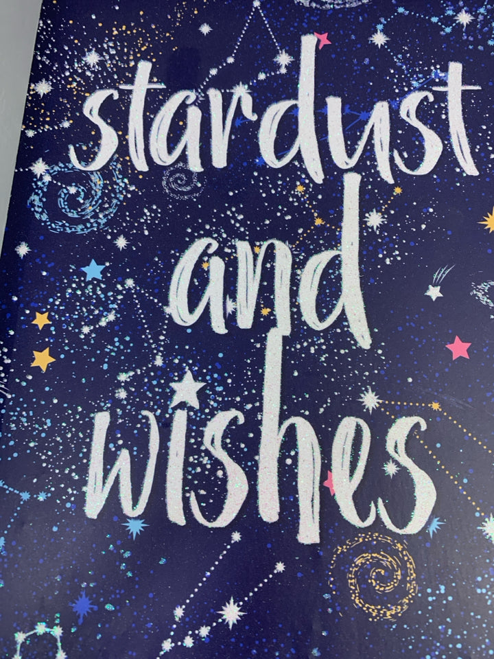 "STARDUST AND WISHES" IN GRAY FRAME.