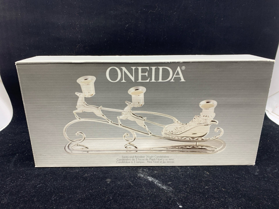 NIB ONEIDA SANTA AND REINDEER 3 TAPER CANDLE HOLDER.