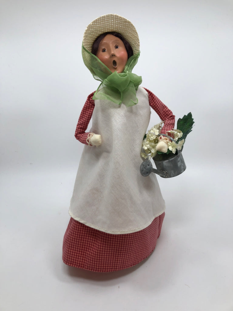 BYERS CHOICE CAROLER W/WATERING CAN.