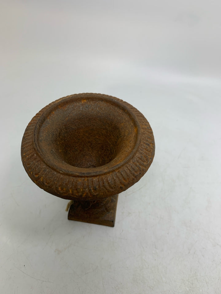 RUSTED HEAVY METAL FOOTED VASE.