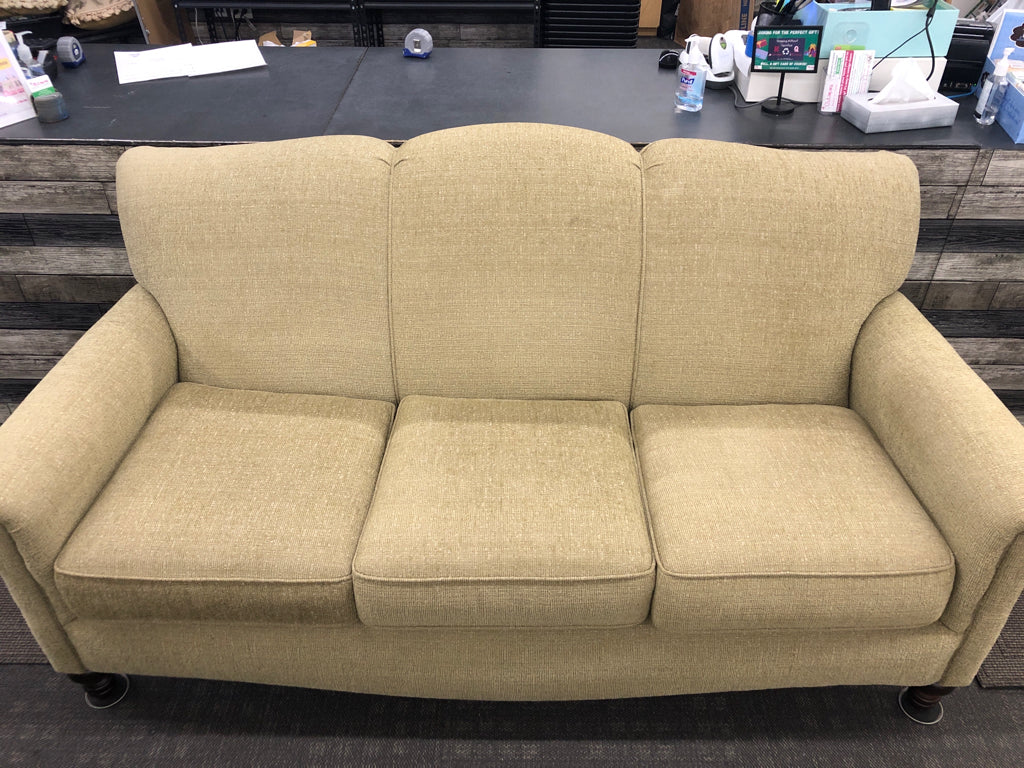 ARTICHOKE GREEN SOFA W/ BROWN WOOD LEGS.