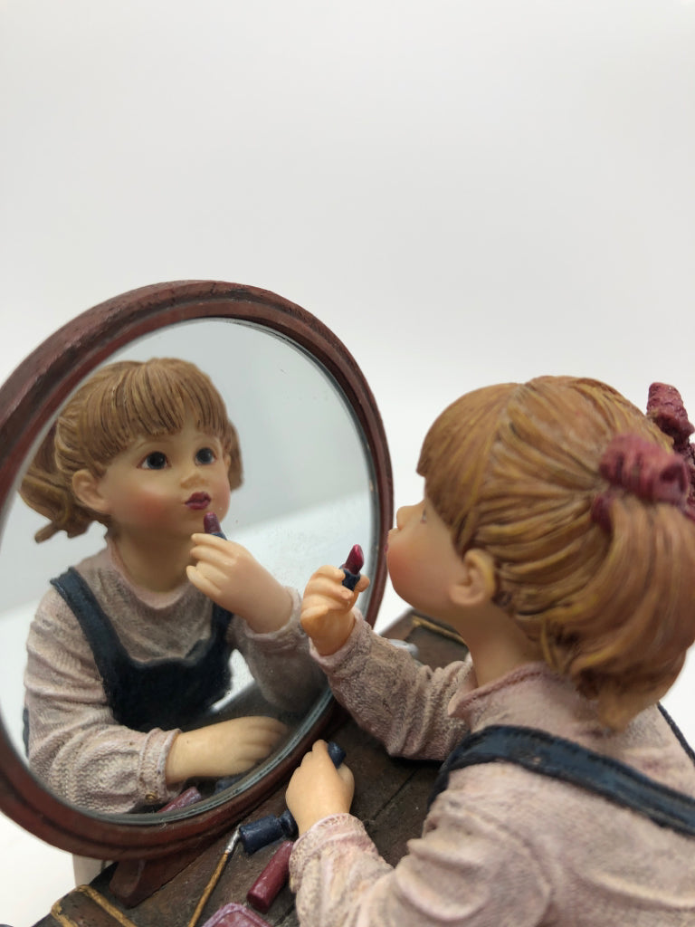 RESIN GIRL FIGURINE APPLYING MAKEUP.