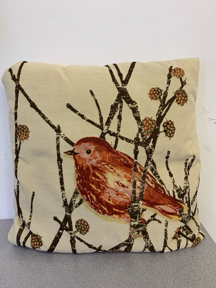 CREAM PILLOW WITH RED BIRD.