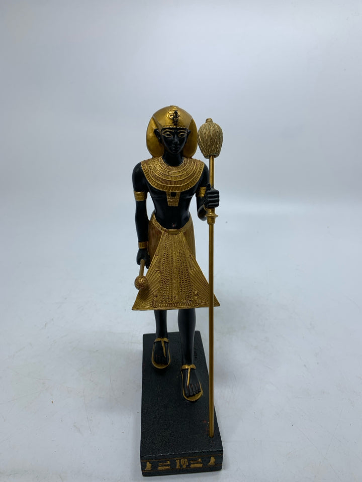 GOLD STANDING EGYPTIAN STYLE MAN W/ SANDALS HOLING STICK RESIN.