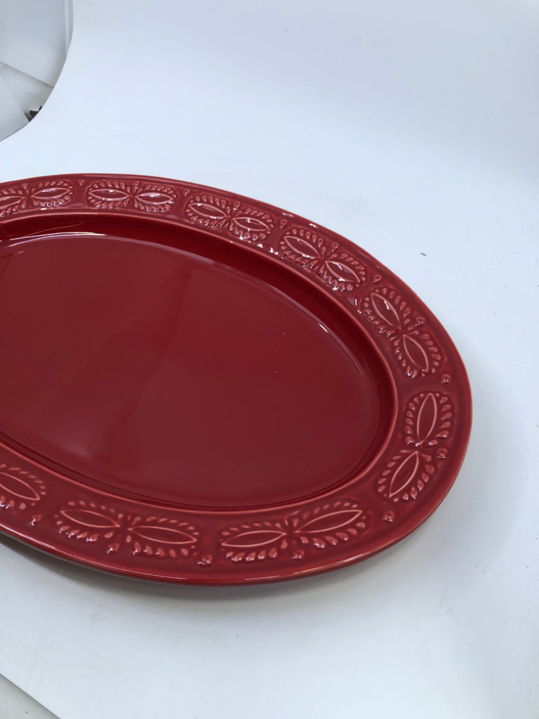 RED OVAL SERVING PLATTER W/ EMBOSSED EDGE.