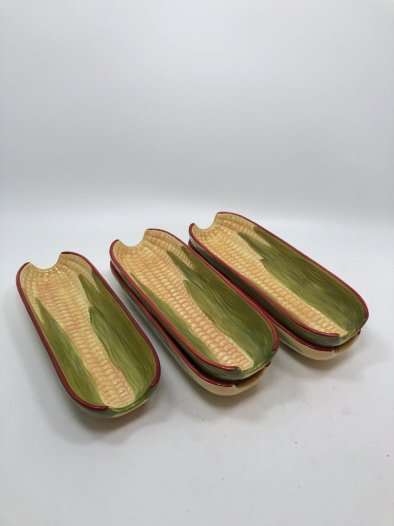 5 CERAMIC CORN HOLDERS.