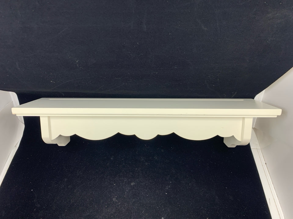 WHITE WALL SHELF W/ SCALLOP DESIGN.