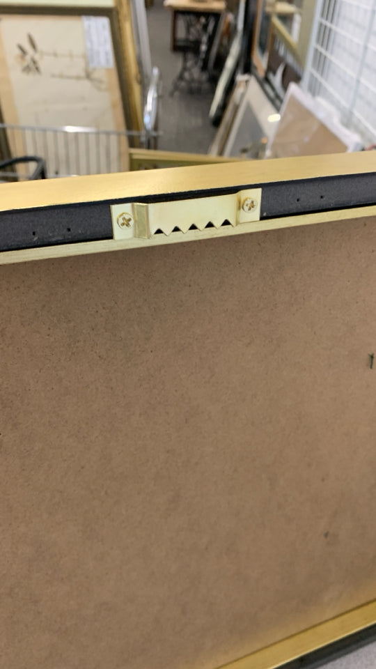 BRONZE METAL SHIPS MOUNTED ON GOLD FRAME.